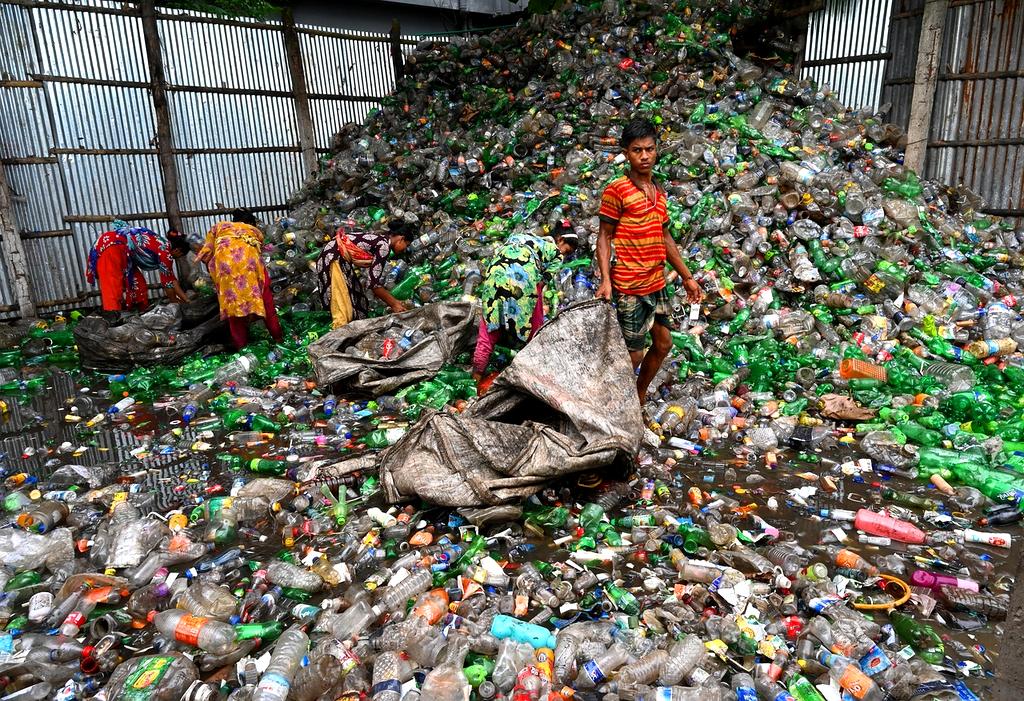 Family sorting waste in their home